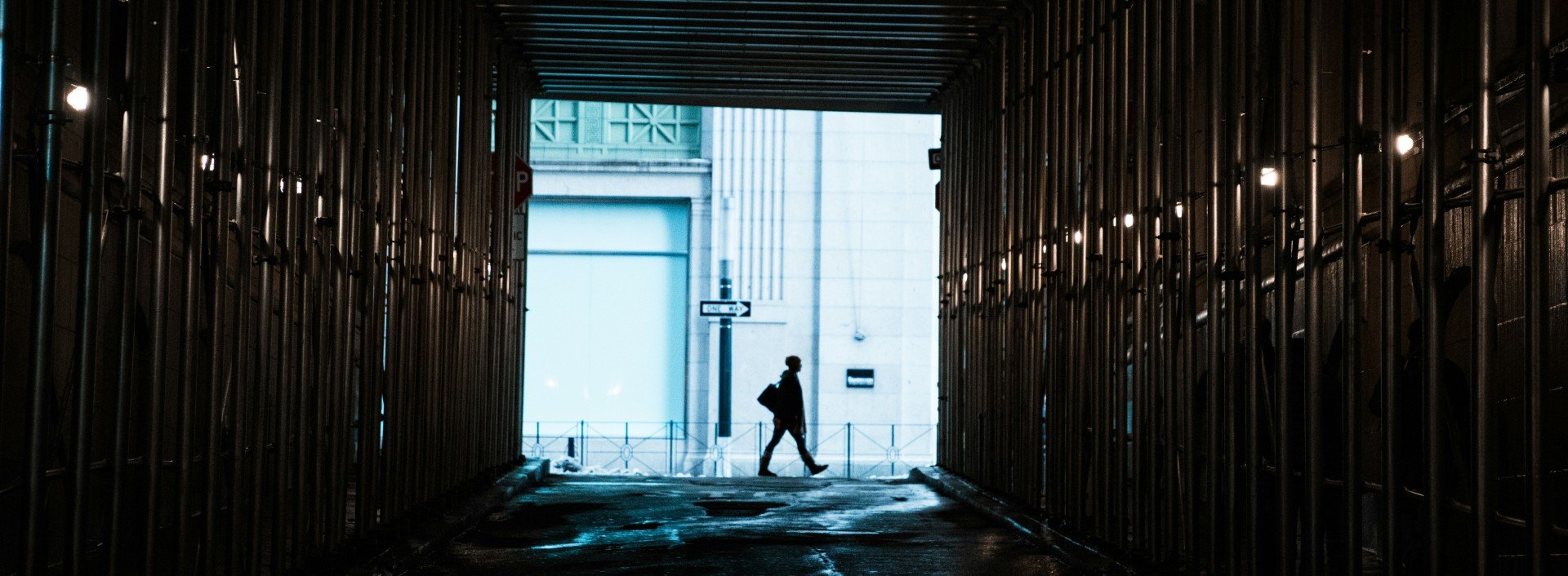 A person walks in a city while practicing walking vocabulary.